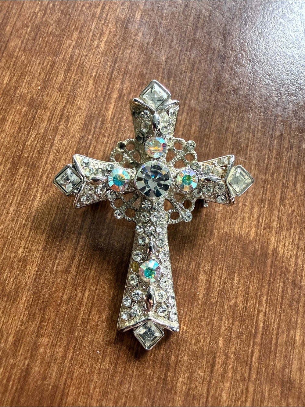 Sparkly cross pin / brooch (missing one stone)